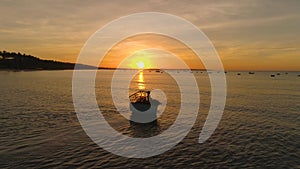 MUINE, VIETNAM - MAY, 2023: Aerial drone view of beautiful seashore, fisherman on small boats are busy early morning