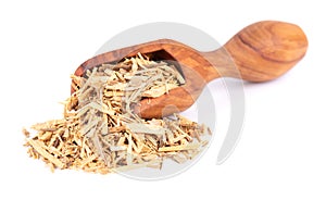 Muira Puama herbal tea in wooden scoop, isolated on white background. Natural potency wood, medicinal plant, dry tea