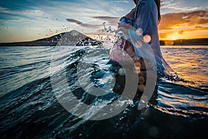 Pregnant woman bathing in the sea photo