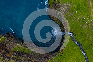 Mulafossur waterfall aerial drone view in Gasadalur, Vagar