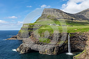 Mulafossur waterfall in Gasadalur village in Faroe Islands, North Atlantic Ocean. Nordic Natural Landscape