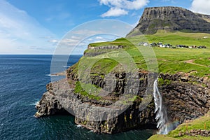 Mulafossur waterfall in Gasadalur village in Faroe Islands, North Atlantic Ocean. Nordic Natural Landscape