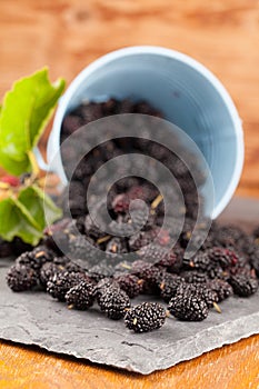 Mulberries split on a slate board