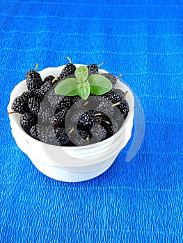 Mulberries in a white bowl