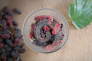 Mulberry fruits in clear glass