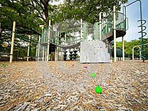 Mulch ground playground with step climbing and colorful plastic eggs for kids Easter egg hunt activity near Dallas, Texas, America