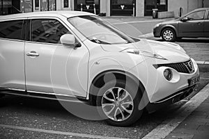 Front view of white Nisssan Juke crossover parked in the street