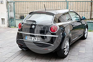 Rear view of black Alfa Romeo Mito car parked in the street