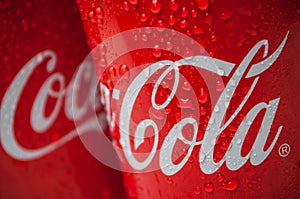 Drops of water on Coca-cola can tue famous brand of american soft drink