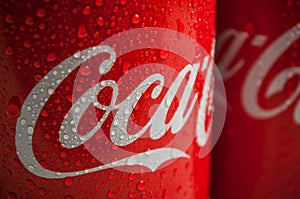 Drops of water on Coca-cola can tue famous brand of american soft drink