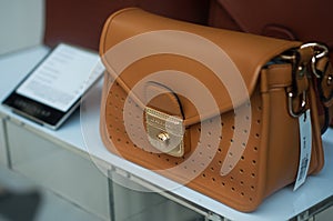 Longchamp leather handbag in a luxury fashion store showroom