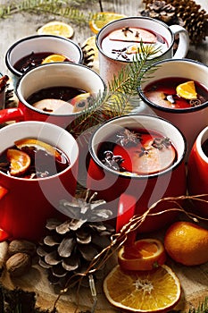Mulled hot wine or gluhwein in cups of different shapes