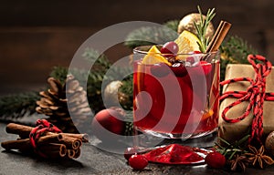 Mulled red wine with Christmas decorations in background