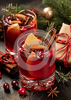 Mulled red wine with Christmas decorations in background