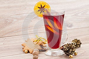 Mulled red wine on wooden table
