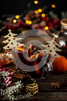 Mulled wine, hot warming drink with spices and oranges, Traditional hot drink at Christmas