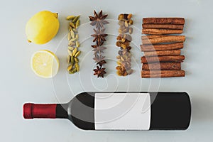 Mulled wine recipe ingredients on gray wooden table. Christmas or winter warming drink.