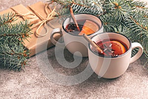 Mulled wine in a small vintage cups with present