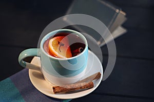 Mulled wine with spice and orange close-up