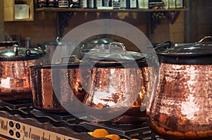 Mulled wine in traditional copper cauldron at the christmas market