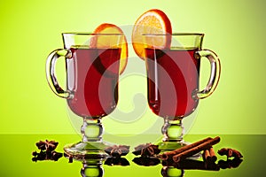 Mulled wine in two glasses on green
