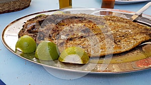 Mullet - open roasted fish lemon dish - food of west Greece called