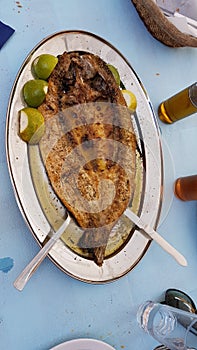 Mullet - open roasted fish lemon dish - food of west Greece called `Petali` photo