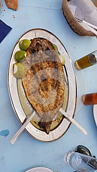 Mullet - open roasted fish lemon dish photo