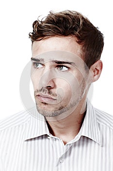 Mulling things over. Cropped studio shot of a pensive young man isolated on white.