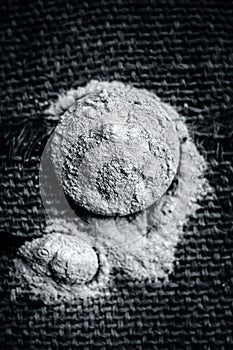 Mulpani mitti or Fuller`s earth in a glass plate on jute bag surface.