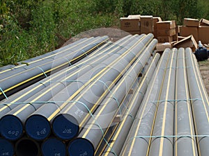 Multi bundles of new presurized gas pipeline on job site.