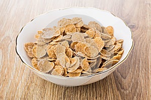 Multi cereal flakes in glass bowl on table