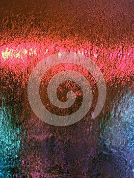 Multi-color abstract background that are bubbles on a windshield going thru a car wash