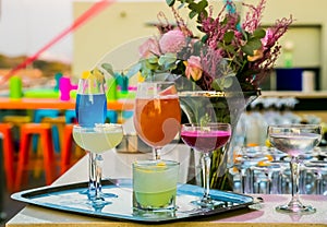 Multi color Cocktail drinks on a bar counter