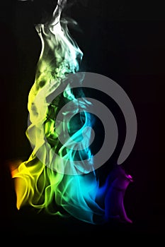 Multi Color Fire Flame Abstract on black background. A mystic colorful smoke. Blurry bright abstraction with colored lines. Magic