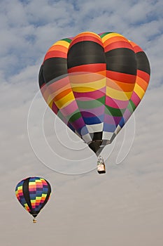 Multi color hot air balloons flying in blue sky