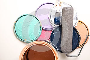 Old paint cans on white