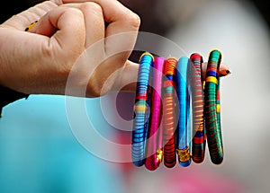 The multi-color verity of Hard end Bangle in hand