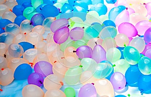 Multi-colored balloons filled with water prepared for the game