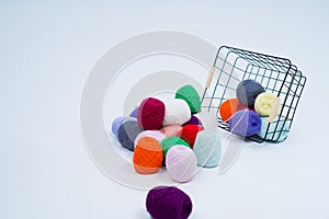 Multi-colored balls of thread.