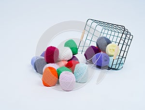 Multi-colored balls of thread.