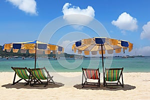 Multi-colored beach umbrellas and chaise lounges