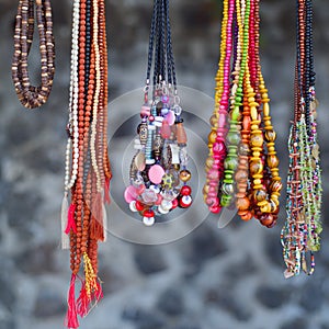 The multi colored beads necklaces hanging