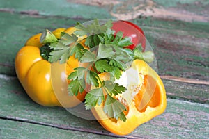 Multi-colored bell peppers on the background of boards