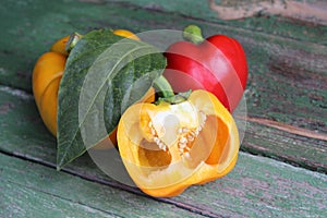 Multi-colored bell peppers on the background of boards