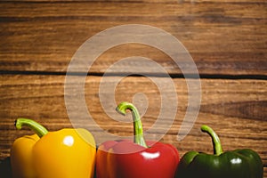 Multi colored bell peppers on chopping board