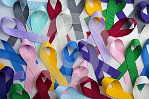 Multi colored cancer ribbon background. Proudly worn by patients, supporters and survivors for world cancer day. Bringing awarenes