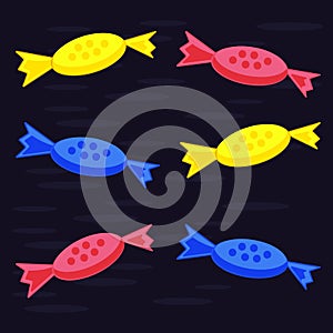 Multi-colored candy on a dark blue background