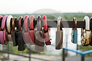 Multi-colored castles that hang newlyweds on bridges