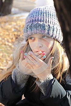 Multi-colored children`s pastel manicure.Winter nails.